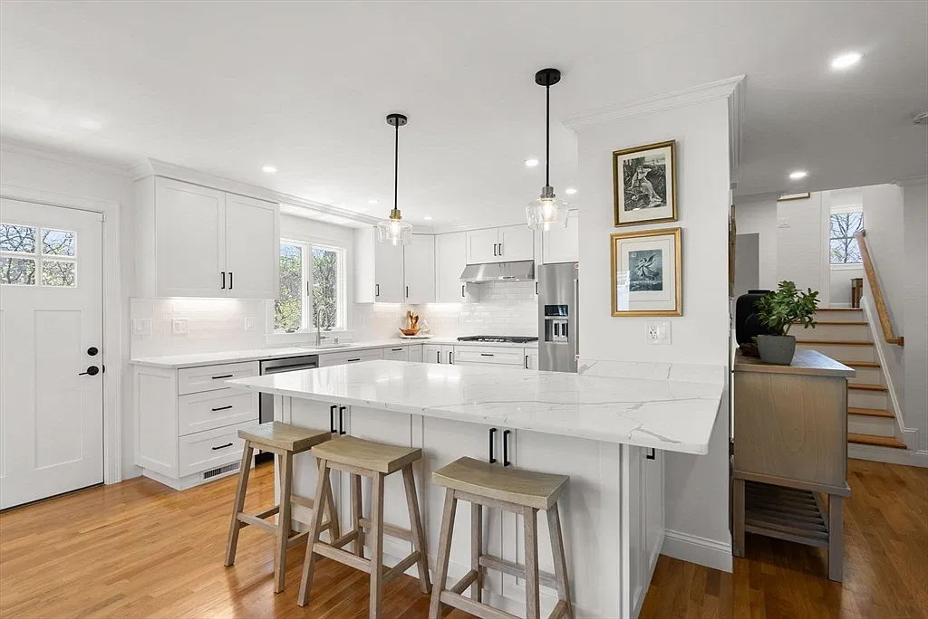 Kitchen and staircase in the Amesbury home