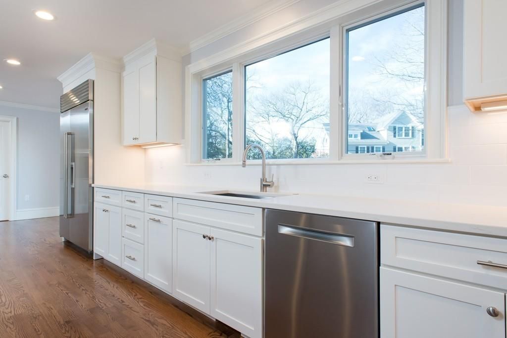 Finished white kitchen in a Belmont home, built by Almeida General Construction